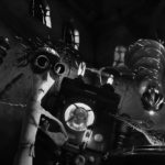 Black and white screenshot of an animated stop-motion scene inside a lab where the main foregrounded character wears goggles.